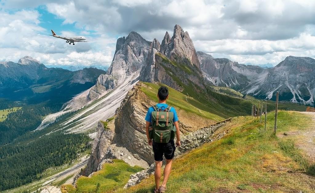 Hiking Seceda ridgeline in the Dolomites under a cloudy sky